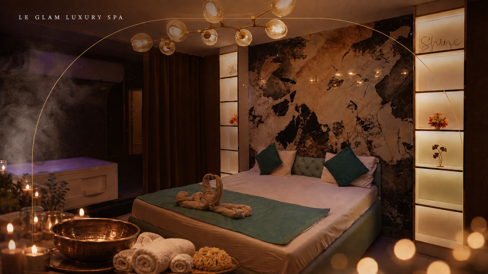 Couple treatment suite with swan towels and gold chandelier