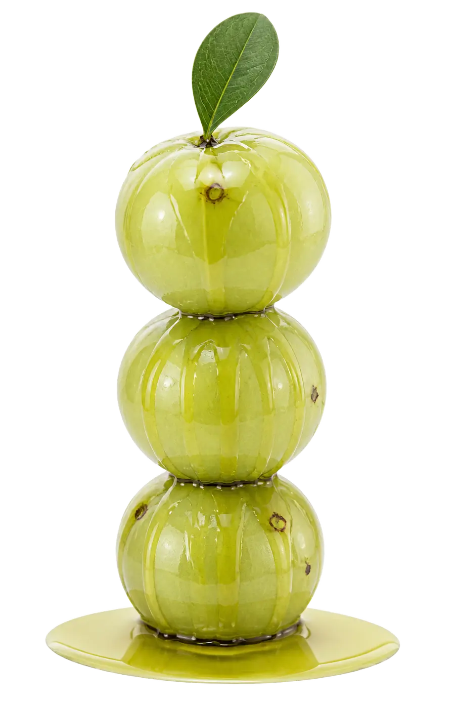 Stacked fresh amla fruit with herbal oil, representing natural spa therapies